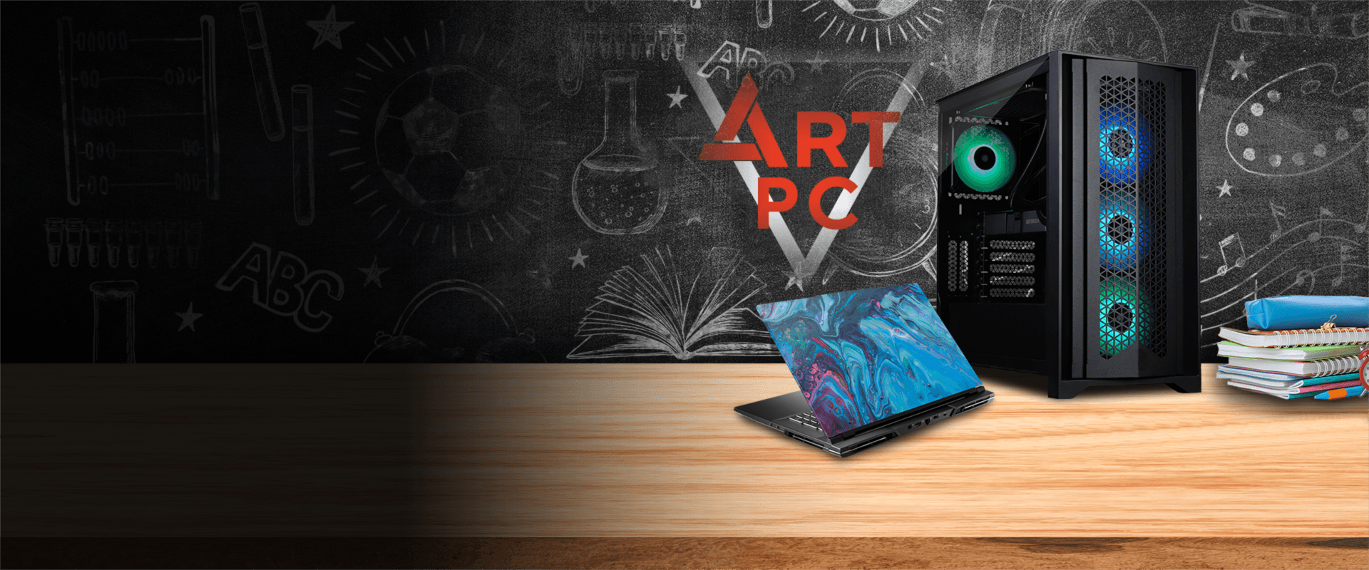 Бюджетный игровой системный блок с RGB вентиляторами и ноутбук на деревянном столе на фоне школьной доски.